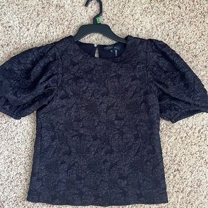 textured black top, puff sleeve. Size XS